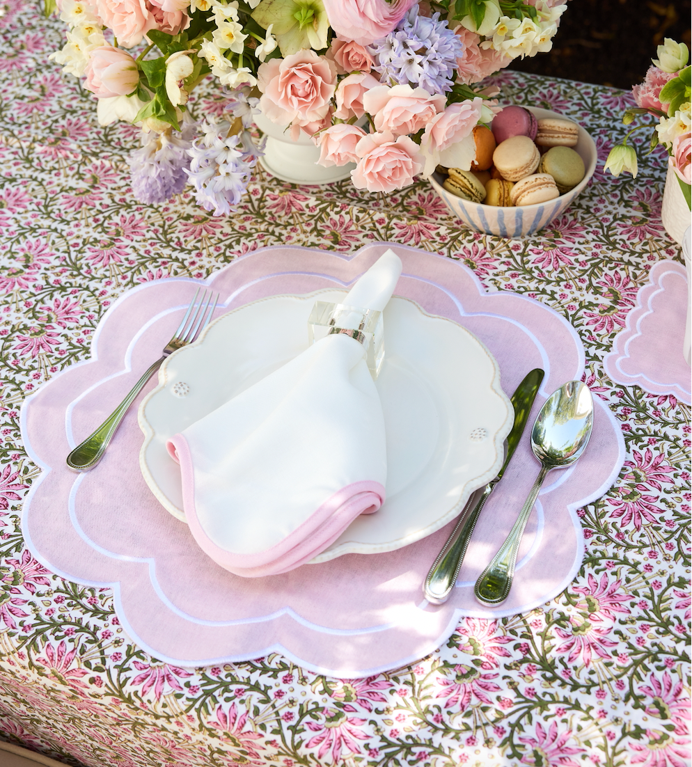 Round scalloped pink placemat